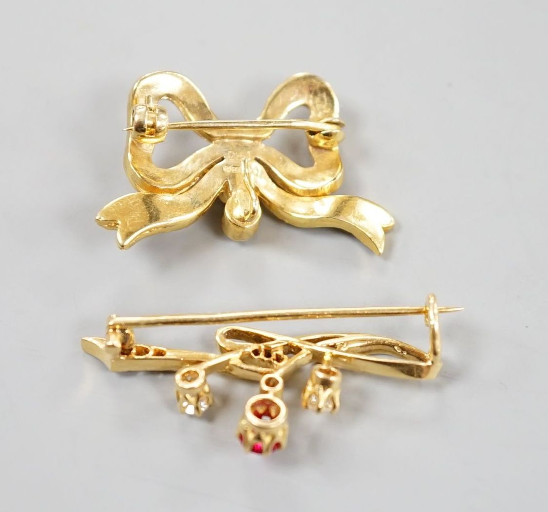A yellow metal, ruby? and diamond set brooch, 36mm and a modern 9ct gold and split pearl set ribbon bow brooch, gross 8.5 grams.